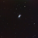 NGC 4449 is an irregular Magellanic type galaxy in the constellation Canes Venatici, being located about 13 million light-years away. It is part of the M94 Group or Canes Venatici I Group that is relatively close to the Local Group hosting our Milky Way galaxy.
This galaxy is similar in nature to the Milky Way's satellite galaxy, the Large Magellanic Cloud (LMC), though is not as bright nor as large. NGC 4449 has a general bar shape, also characteristic of the LMC, with scattered young blue star clusters.
Unlike the Large Magellanic Cloud, however, NGC 4449 is considered a starburst galaxy due to its high rate of star formation (twice the one of the LMC) and includes several massive and young star clusters, one of them in the galaxy's center.
56*2min med IDAS HEUIB-filter. Snö och mycket ljusreflexer. NGC 4449