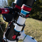 The TS Optics 80mm, focal length 328mm, guidescope which has a separate ZWO ASI 290MM mini guide camera. The red bands are heater bands to eliminate dew.
I have now switched to use a ZWO Off Axis Guider (OAG) which uses a prism to capture stars directly throgh the main telescope. The guide camera is still the same. 80mm, focal length 328mm, guidescope