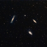 The Leo Triplet (also known as the M66 Group) is a small group of galaxies about 35 million light-years away in the constellation Leo. This galaxy group consists of the spiral galaxies M65, M66, and NGC 3628.. The distance is approximately 35 million lightyears.
Photographed with APO 107mm refractor and ASI 2600MC camera in Åva, April 2021. Exposure was 40*2min without any filter. M65, M66, and NGC 3628, The Leo Triplet