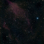 The California Nebula (NGC 1499) is an emission nebula located in the constellation Perseus. It is so named because it appears to resemble the outline of the US State of California on long exposure photographs. It is almost 2.5° long on the sky and, because of its very low surface brightness, it is extremely difficult to observe visually. It can be observed with a Hβ filter (isolates the Hβ line at 486 nm) in a rich-field telescope under dark skies. It lies at a distance of about 1,000 light years from Earth. Its fluorescence is due to excitation of the Hβ line in the nebula by the nearby prodigiously energetic O7 star, xi Persei (also known as Menkib, seen at center below it in the inset at right.
An early attempt to photograph the nebula with the CPC 925 reflector telescope and the Nikon D800 DSLR camera in Åva, February 2016. 10 exposures at 210 s each at ISO 800. NGC 1499 California Nebula