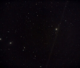 Messier 87 (right) is a supergiant elliptical galaxy in the constellation Virgo. One of the most massive galaxies in the local universe, it is notable for its large population of globular clusters—M87 contains about 12,000 compared to the 150–200 orbiting the Milky Way—and its jet of energetic plasma that originates at the core and extends outward at least 1,500 parsecs (4,900 light-years), travelling at relativistic speed. (Visible to the left in my picture.)
The distance estimate is 16.4 ± 0.5 megaparsecs (53.5 ± 1.63 million light-years).
Photographed with APO107 refractor telescope and Nikon D800 DSLR camera from my garden in Stuvsta, April 2018. Exposure was 9 * 2 min at ISO 800. M87